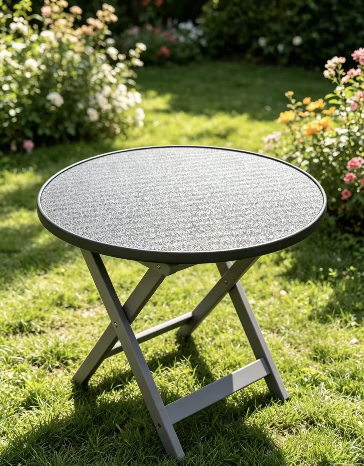 Folding round-table top in a garden